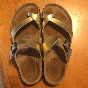 Gold Birkenstock sandals